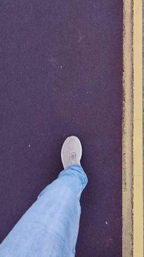 First person point view walking on sidewalk. Video stock 328968311