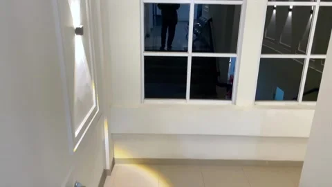 First person point of view walking down modern house stairs in home interior Видео 347725935