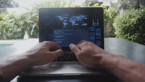 First-person portrait programmer geek freelancer working at a laptop outside the Stock-Footage 100805834