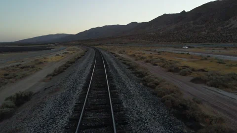 First person POV of train tracks chugging through the empty desert during Stock Footage 162447282