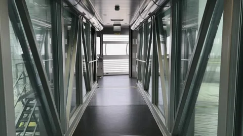First-person pov walking inside empty passenger bridge Stock-Footage 276673131