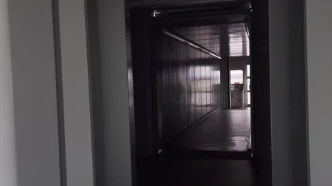 First-person pov walking inside empty passenger boarding bridge Stock Footage 284451116