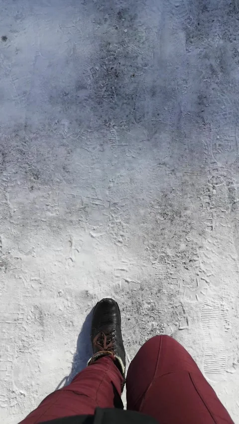First-person top-down view of the winter walk on snowy ground Stock Footage 302900178