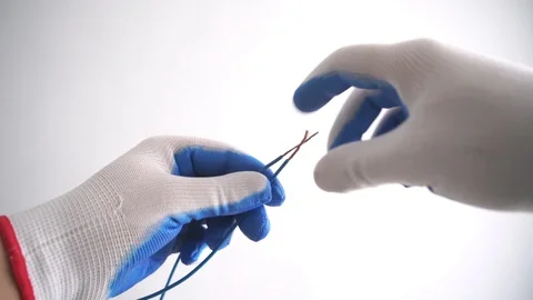 First-person twisting of two wires. Splicing electrical wires Stock Footage 121574100