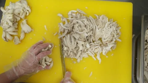 First-person view from above on slicing mushrooms and female hands in gloves Stock-Footage 150987610