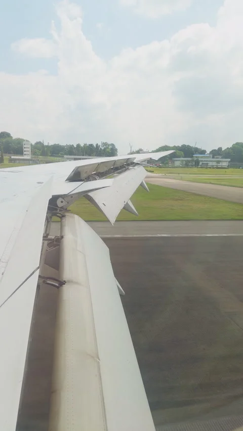 First Person View From Airplane Window During Landing And Braking On Airport Run Stock Footage 336815964