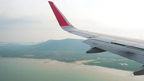 First person view of an airplane wing in flight Stock Footage 272484700