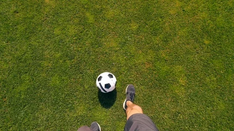 First-person view of an athlete with a bionic leg dribbling a ball Stock Footage 116800866