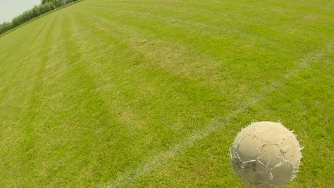 First person view, boy plays football and scores in the goal. Stock Footage 244585012