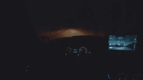 First-person view of car control, drive a car at night Stock Footage 321878203