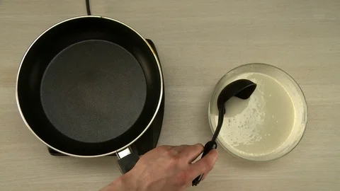 First-person view on chef cooks dough for pancakes Stock Footage 82759582