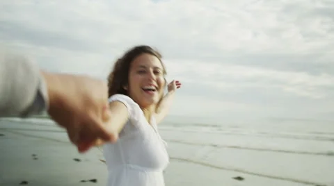 First person view of a couple having fun on the beach Video stock 50060005