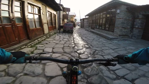 First Person View Of Cycling Through A Medieval European Village Stock Footage 101569238
