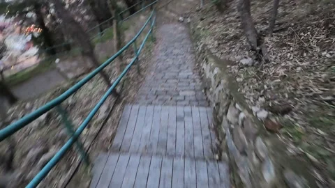 First person view down the stairs from the hill. Video stock 219821041