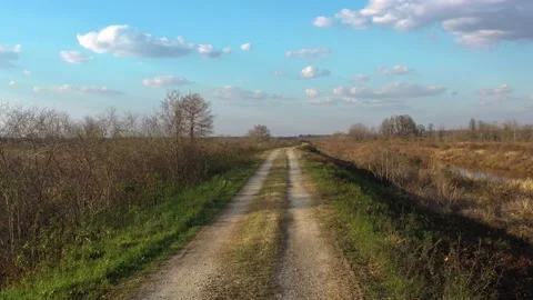 First person view driving on a bumpy rural dirt road Vídeo Stock 153800657