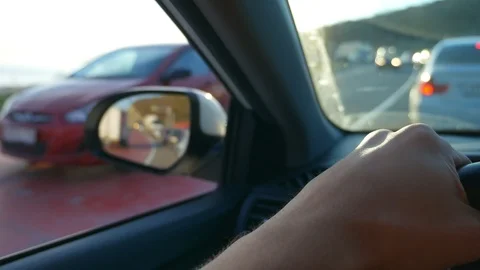First-person view. Driving a car in rush hour Stock Footage 106541144