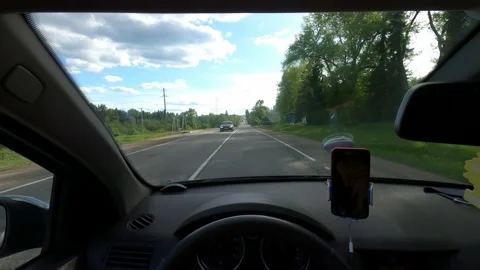 First-person view of driving a car in countryside Stock Footage 169074073