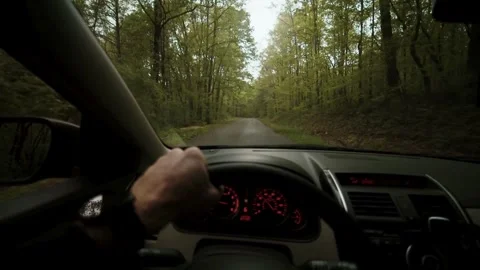 First person view of driving a car on countryside roads. traveler driving on Stock-Footage 336266767