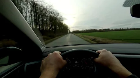 First person view of driving a car on countryside roads. traveler driving on Stock-Footage 336267138
