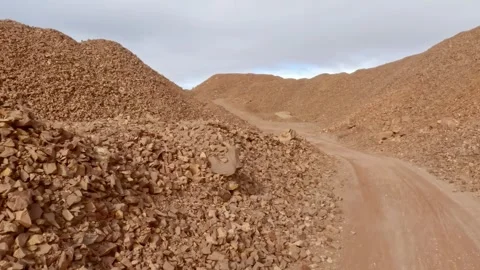 First-person view driving through an old quarry with spoil heaps in morocco 스톡 동영상 330660103