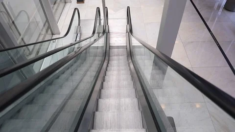 First person view of the escalator going down Stock Footage 95941854