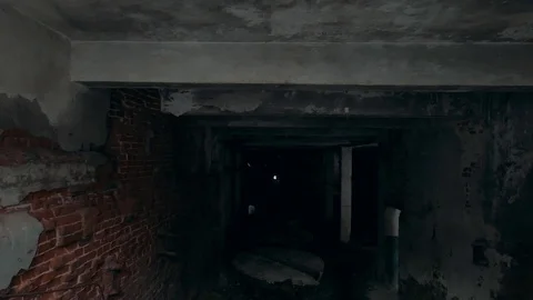 First person view with flashlight in dirty grungy corridors or tunnel in Stock Footage 100983008