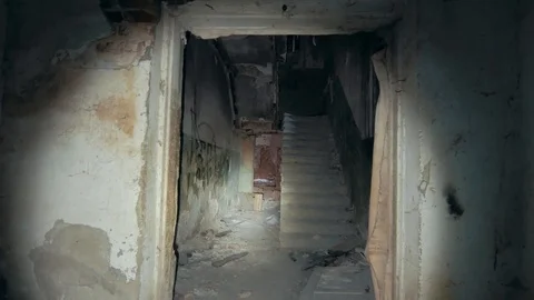 First person view with flashlight in dirty grungy corridors or tunnel in Stock Footage 100983163