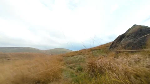 First person view flying over scottish highlands landscape Stockbeeldmateriaal 327849746