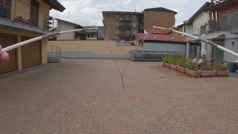 First-person view of hands creating big soap bubble slow motion Video stock 279890351