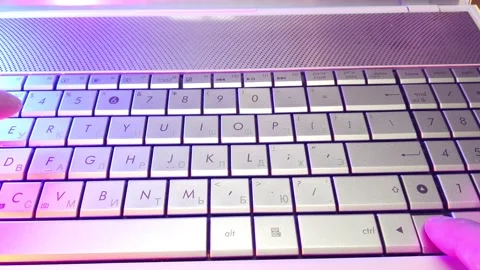First-person view, hands type text on laptop keyboard Stock Footage 144541068