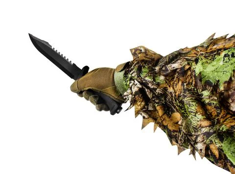 First person view hunter hand in camouflated suit with knife. Foto stock
