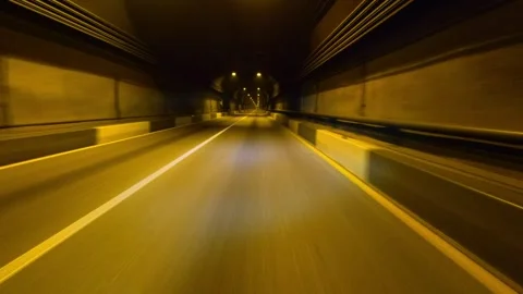 A first-person view from inside a car driving through an underground tunnel in 库存影片 330468388