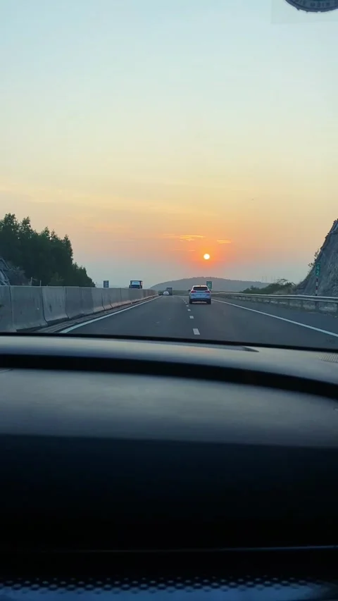 First person view from inside a car driving on a modern multi-lane highway. 스톡 동영상 346045825
