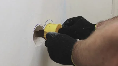 A first-person view - installation of an electrical outlet 動画素材 147172924