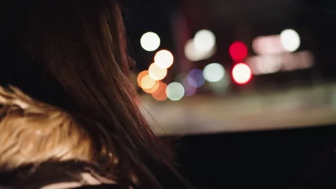 First-person view of a lady rolling down car window at night, handheld camera Stock Footage 280470440