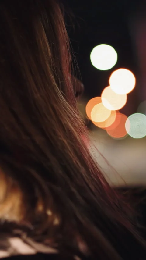 First-person view of a lady rolling down car window at night, handheld camera Stock Footage 317802518
