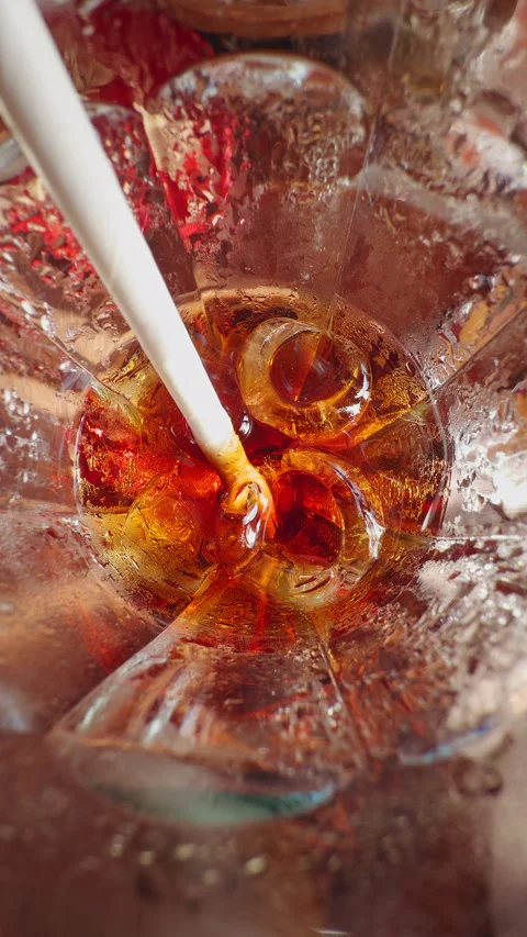 First Person View Looking Into Glass of Cola With Ice Cubes And Straw, Refreshin Stock Footage 336815102