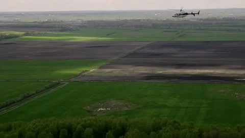 First-person view of a man flying in a helicopter watching a group of parallel Stock-Footage 186708087