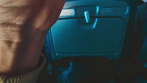 First person view of a man preparing eat banana in road trip in airplane. Lunch Stock Footage 139816433