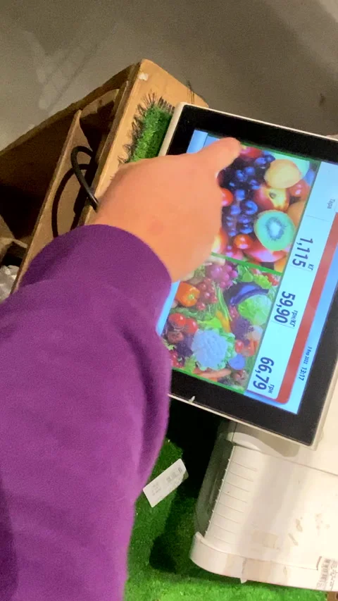 First person view man put price sticker on product in groceries store Stock Footage 211810976