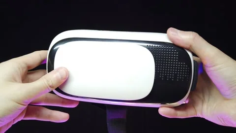 First-person view as a man puts 3D glasses on his head Stock-Footage 131120965