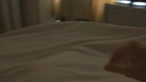 First person view of man waking up and getting out of bed in morning  Stock Footage 85652384