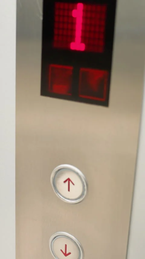 First-Person View of a Modern Elevator Panel with Button Press Stock Footage 316501806