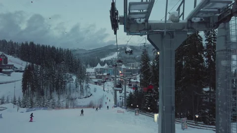 First person view moving down on ski lift with beautiful view on mountains.  Video stock 148450090