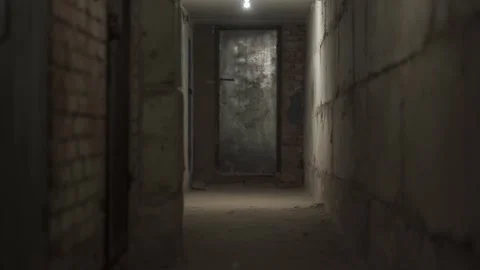 First person view moving straight down a narrow empty dark narrow corridor  Stock Footage 155657572