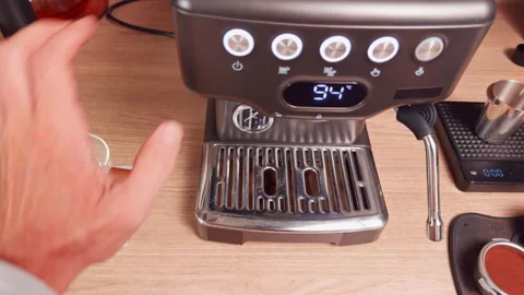First Person View Pressing Brew Button and Flushing Group Head with Water into D Stock Footage 328855343