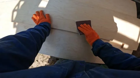 First person view of the process of sanding a wooden board Stock Footage 335025328