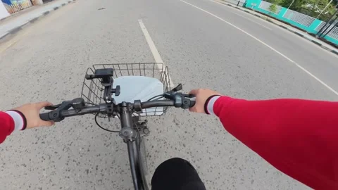 First-Person View of Riding a Bicycle on Road Stock Footage 325417768