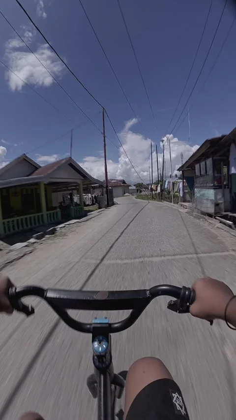 First Person View Riding Bicycle on Village Road Stock Footage 342313236