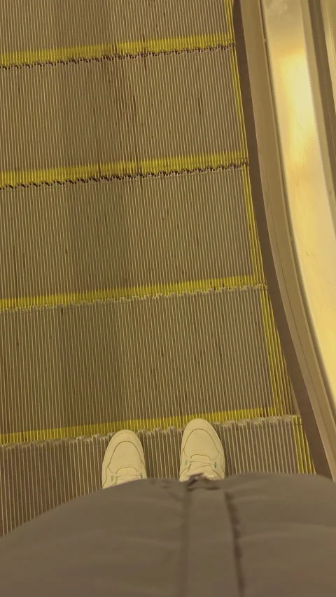 First-Person View Riding an Escalator Stock Footage 274908872